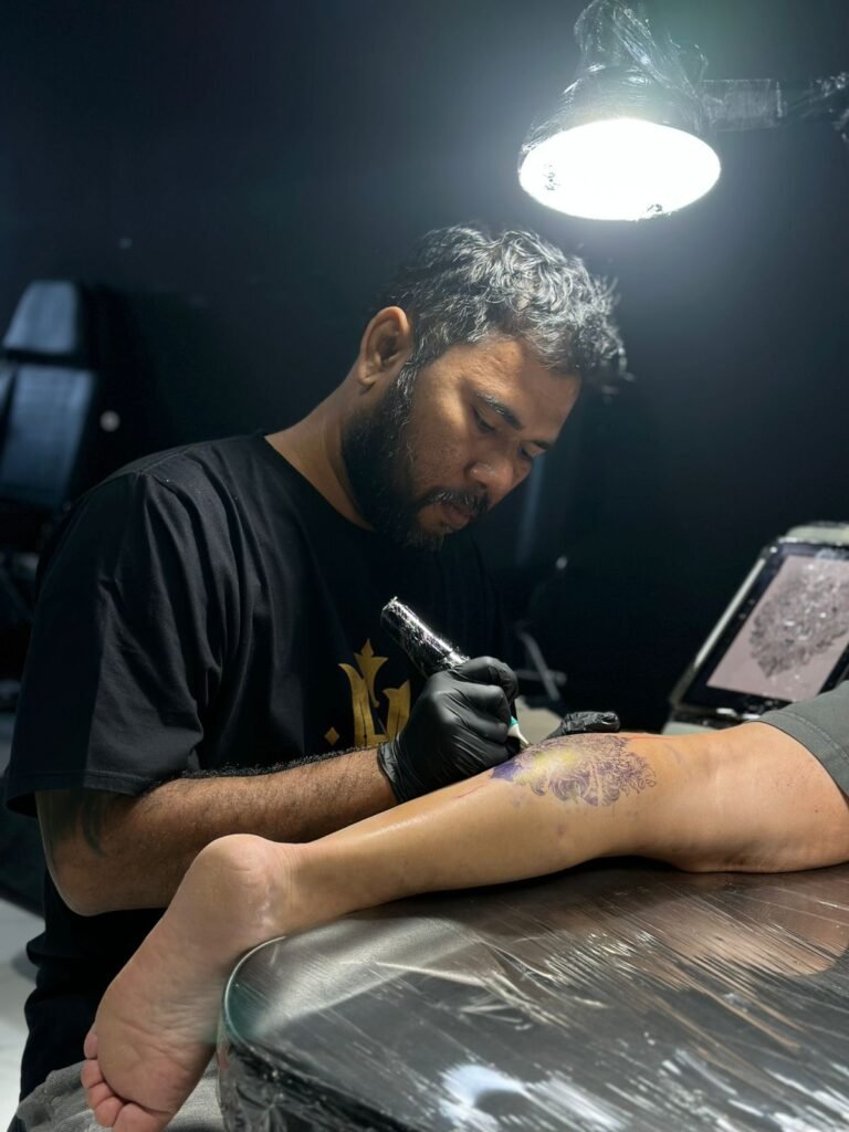 Tattoo artist bali working on tattoo studio