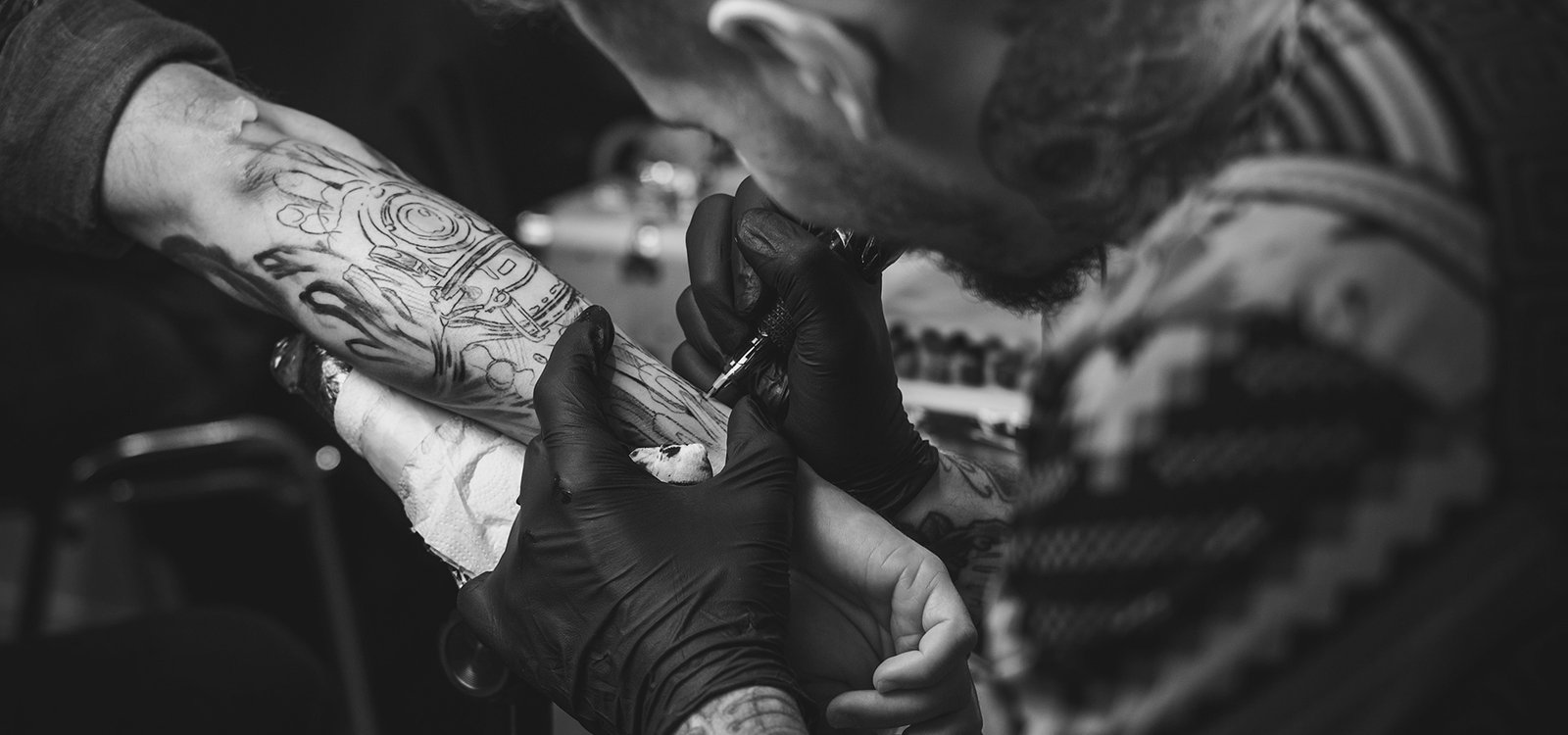 Artist at work at Hustle Ink Tattoo Studio Bali